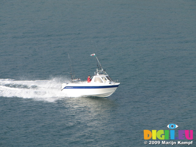 SX03435 Small fishing motorboat in Milford Haven